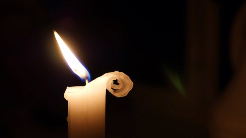 Candle flame in light breeze, wind, wax curling right side, cute